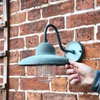 Curved Wall Lantern with hand for scale 