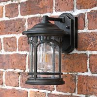 Angled view of bronze wall light in situ 