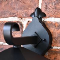 Close up of wall mounted scroll bracket 