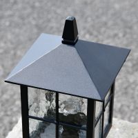 Close up of pillar light angled square top including finial 