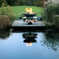 Ring Fire Bowl with Log Store in Garden and Lake