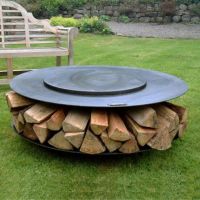 Ring Barbecue Firepit with Log Storage and a Swing Arm Barbecue Rack Cover on 