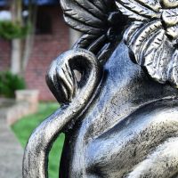 Rear view of Cat Griffin Sculpture with tail 