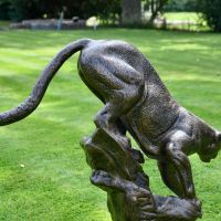 Rear view of cougar sculpture on plinth