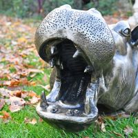Close up of mouth on half hippo sculpture 