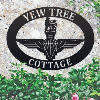 British Parachute Regiment Iron Oval House Sign on a Stone Wall