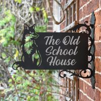 Sitting Fox Iron Bracket House Name Sign in situ on a Brick Wall