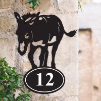 Donkey Iron House Number Sign on a Garden Wall