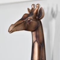 Close up of giraffe head on wall hook 