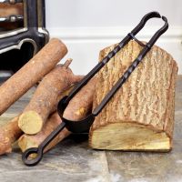 Black Iron Coal Tongs Next to the Fire