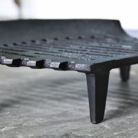 Close up of legs on curved fire grate