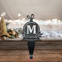 Letter M Stocking Holder in Situ on a Mantel Piece 
