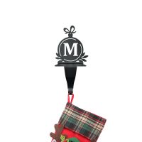Letter M Stocking Holder Holding a Stocking