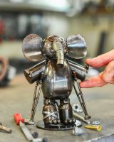 Scale image of recycled metal elephant sculpture