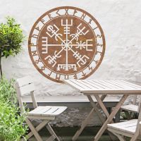 "Vegvisir" Viking Compass Wall Art in the Garden Above a Wooden Table & Chair Set