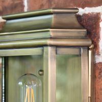 Close up of brushed brass detail on wall light