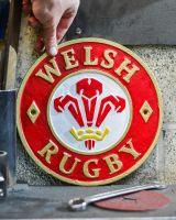 Scale image of hand painted cast iron welsh rugby wall art
