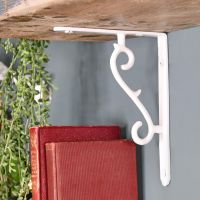 White Scroll Design Shelf Bracket in Situ holding up a Wooden Shelf