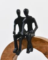 Close up of black cast aluminium figure on home decor ornament