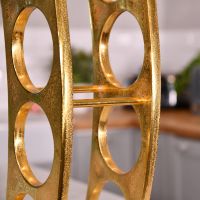 Close up of gold wine rack 