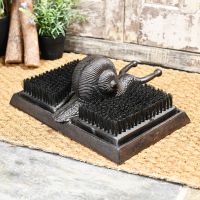 Rustic Snail boot jack & brush by door