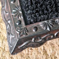 Close up of decorative detailing on cast iron base 