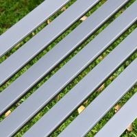 Close-up of the Metal Slates on the Seat of the Bench