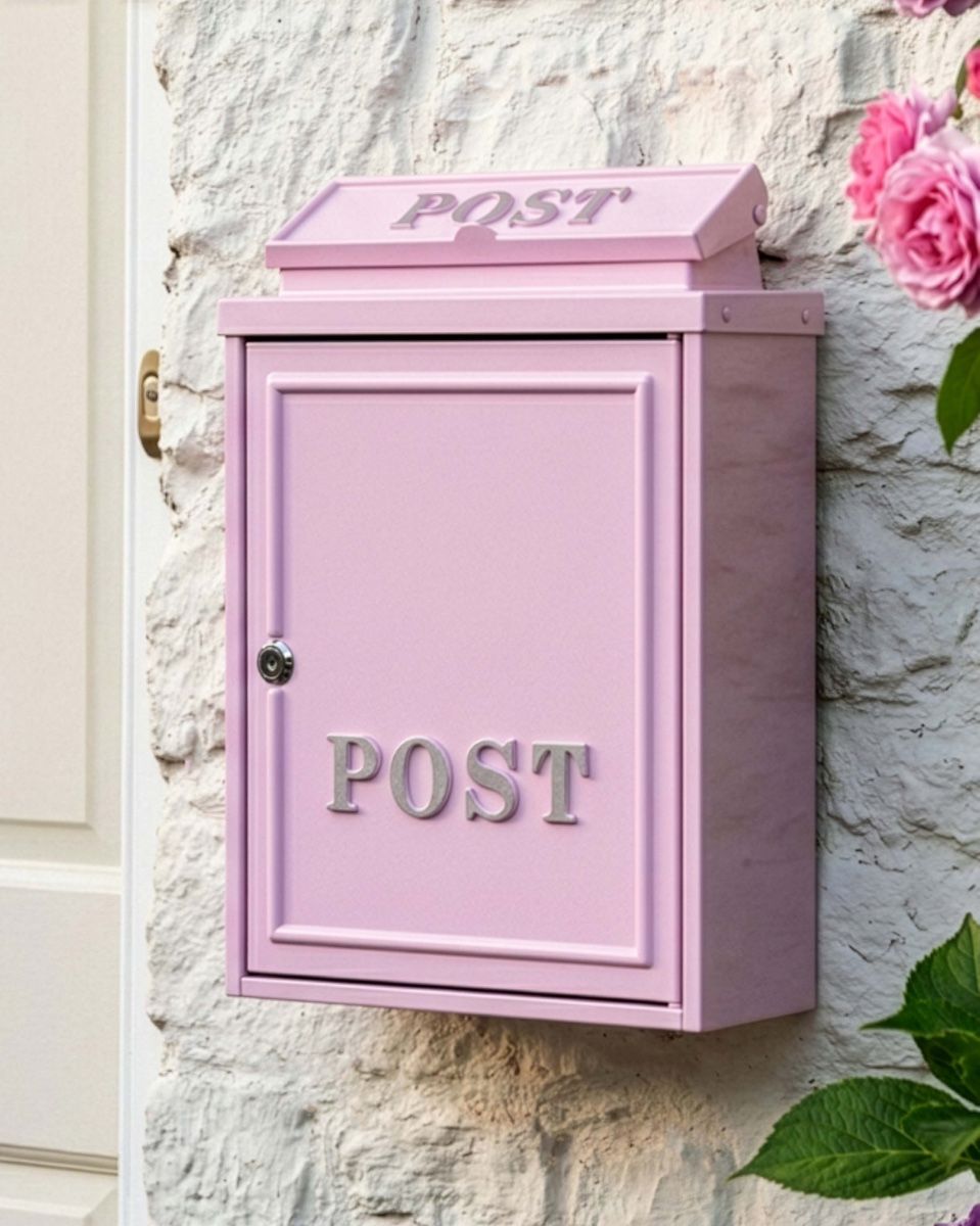 The Pink "Oxford" Wall Mounted Post Box with Silver Detail Shown Mounted on a Brick Wall on a Modern Home - Digital Illustration