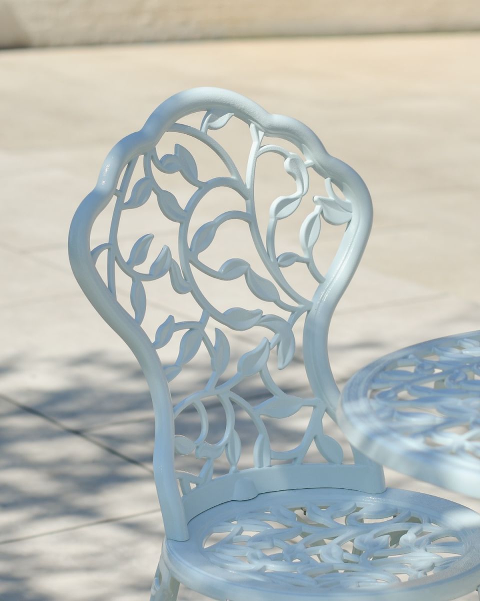 Close up of ornate vine pattern on chair backrest Close up of ornate vine pattern on chair backrest