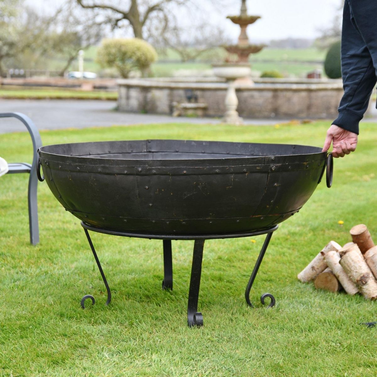 Kadai Bowl with stand in garden setting  Kadai Bowl with stand in garden setting