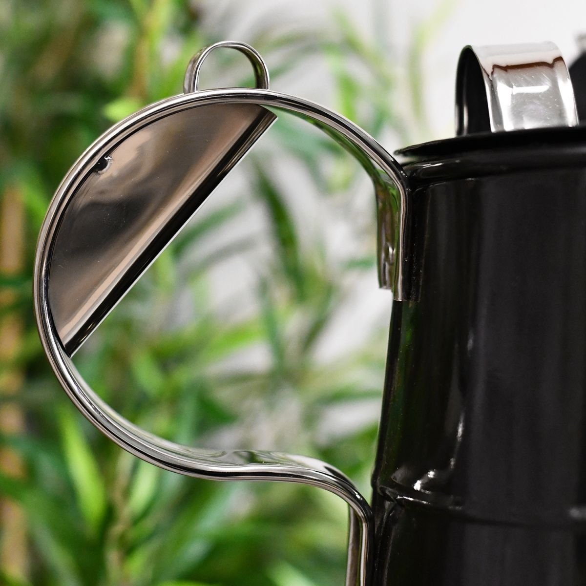 Close-up of the Bright Chrome Handle on the Watering Can