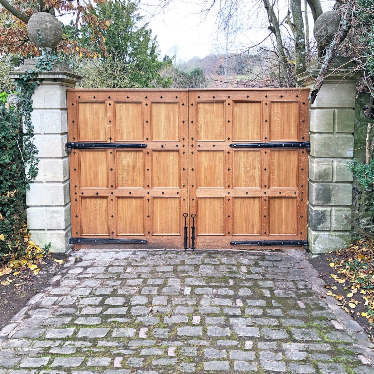 Beautiful Wooden Gates with the "Marlbury" Blacksmith Door Studs Beautiful Wooden Gates with the "Marlbury" Blacksmith Door Studs