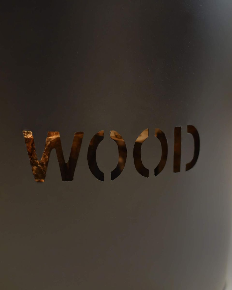 Close-Up of "WOOD" Lettering on "Brettington" Powder Coated Iron Wood Basket Close-Up of "WOOD" Lettering on "Brettington" Powder Coated Iron Wood Basket