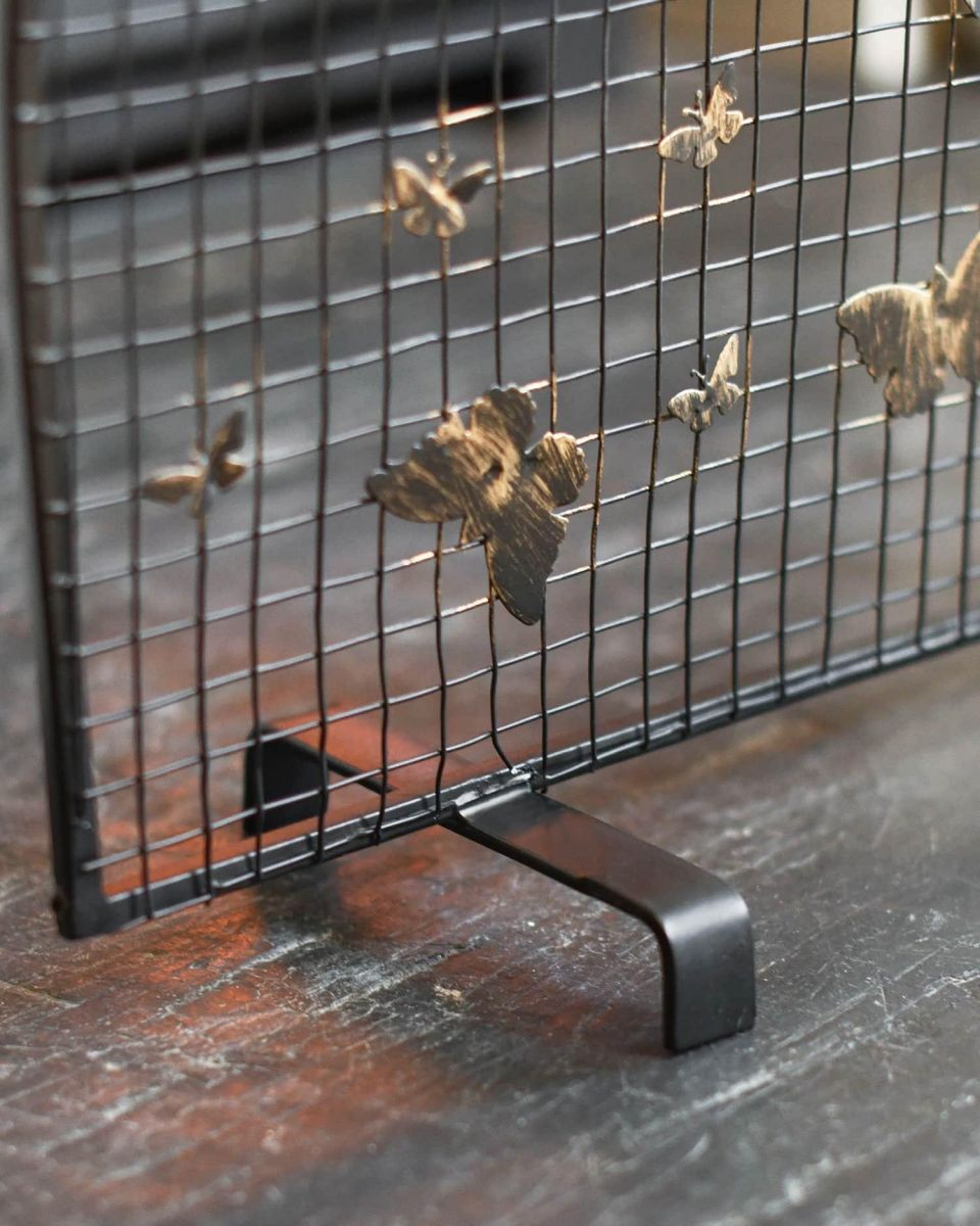 Close-Up of Arched Feet for "Butterfly" Black & Bronze Fire Screen