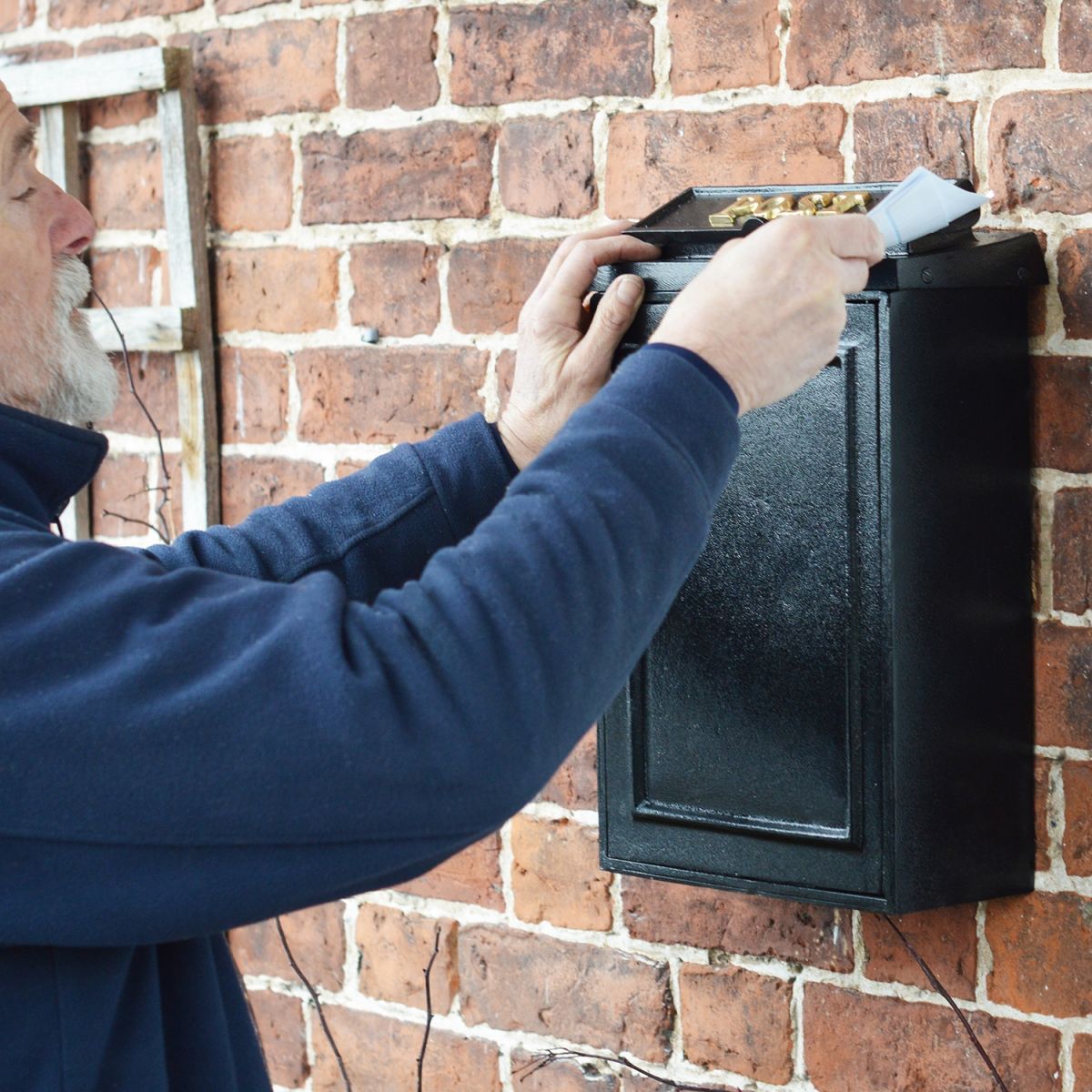 Close-up of the Letter Insert at the Top of the Post Box