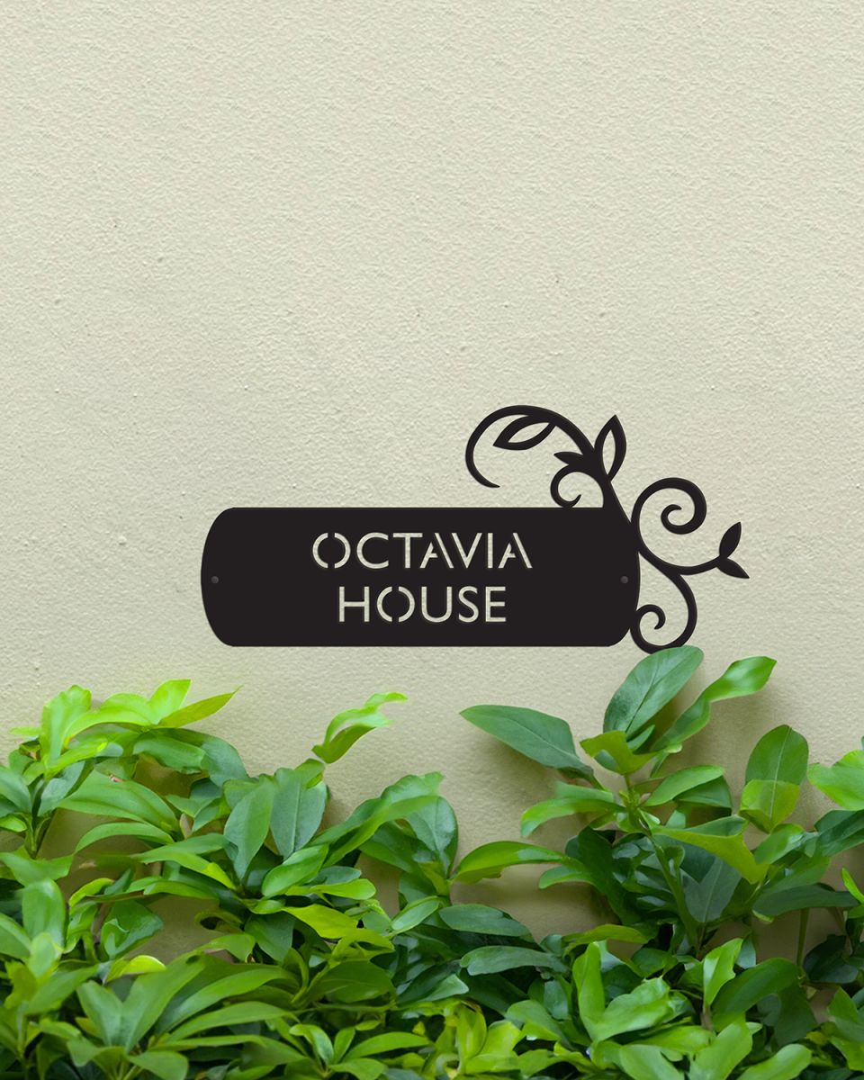 "Lovestone" Steel House Name Sign in Situ on a Painted House Wall "Lovestone" Steel House Name Sign in Situ on a Painted House Wall