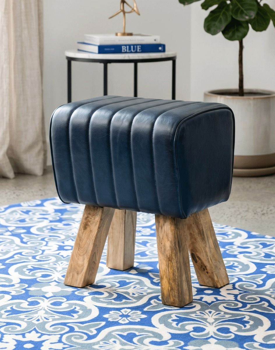 "The Orton" Mango Wood & Blue Leather Stool on a Blue Rug in a Contemporary Living Room - Digital Illustration 
