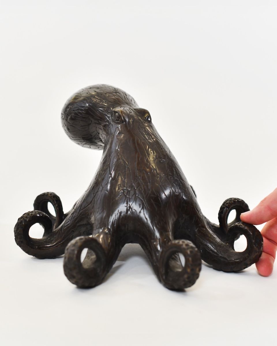 "Abyssal Sentinel" Octopus Sculpture in Cast Brass with hand in shot for scale