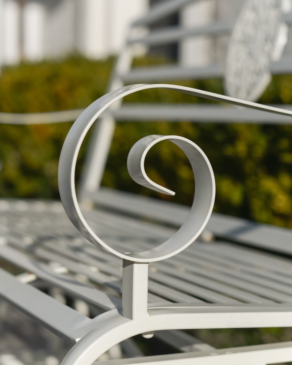 "Arcadia" Garden Rocking Bench Wrought Iron - Cream close up of arm rest