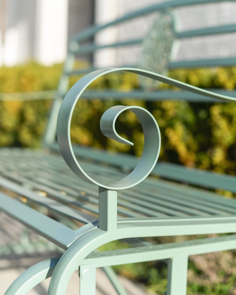 "Arcadia" Garden Rocking Bench Wrought Iron - Sage close up of armrest