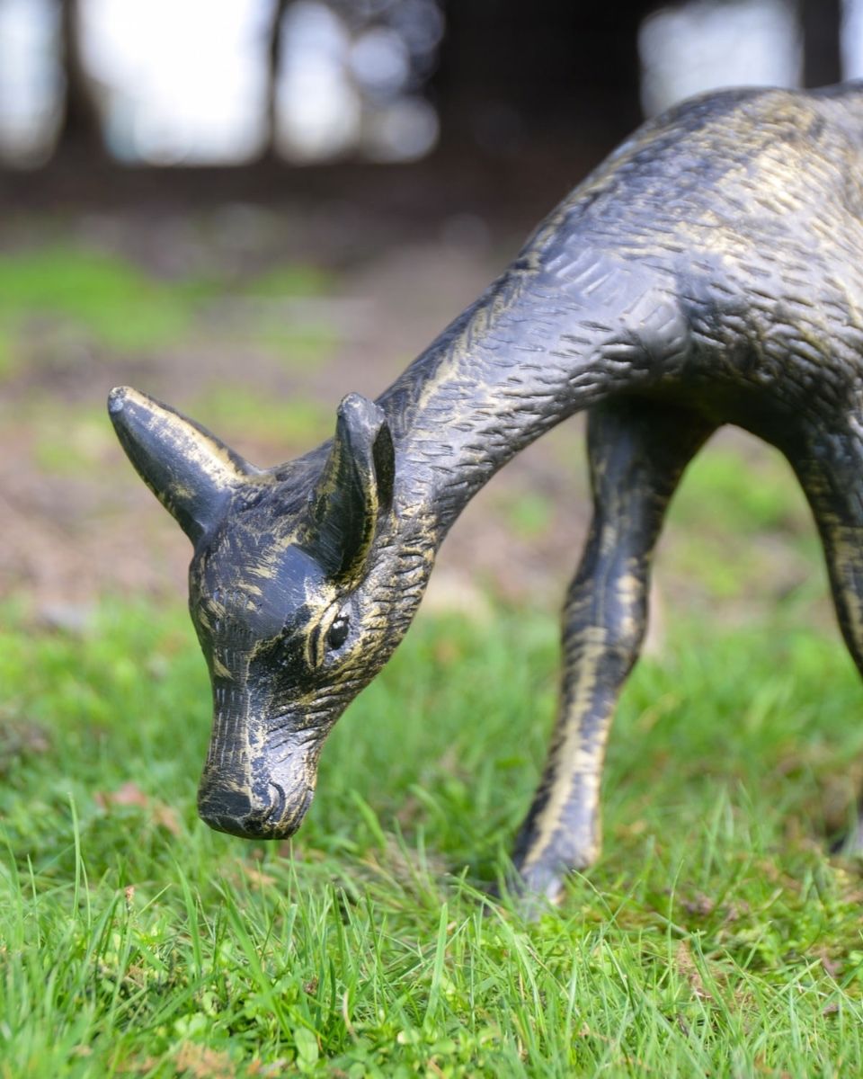 "Arwen" the Grazing Fawn Cast Aluminium Garden Sculpture on a Garden Lawn with a Close up Shot of the Head