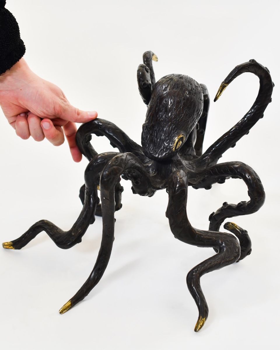 "Aurelian Abyss" Cast Brass Octopus Ornament with hand in shot for scale