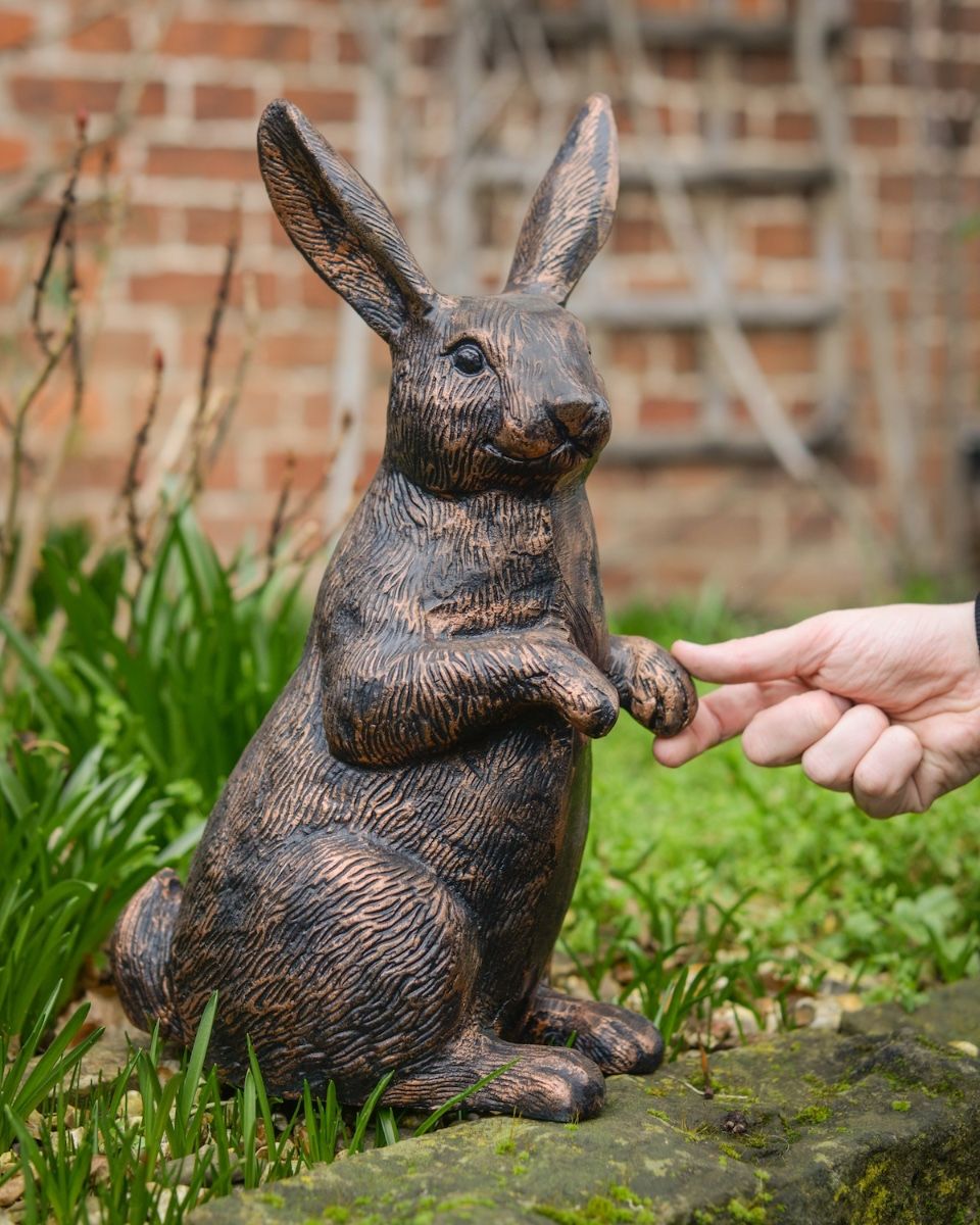 "Barnaby" the Rabbit Cast Aluminium Garden Sculpture with hand in shot for scale