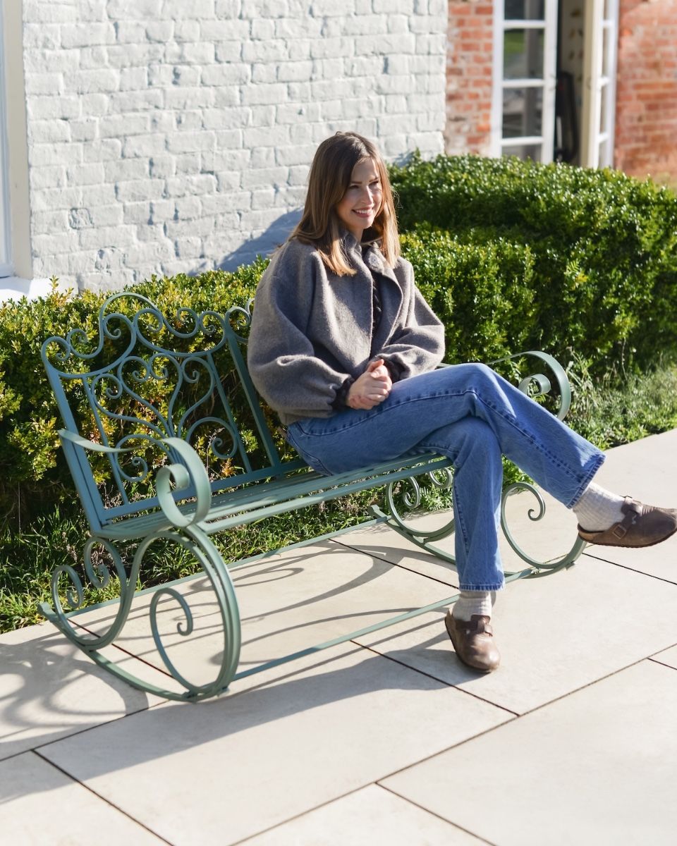 "Belvedere" Garden Rocking Bench Wrought Iron - Sage with lady sat on bench