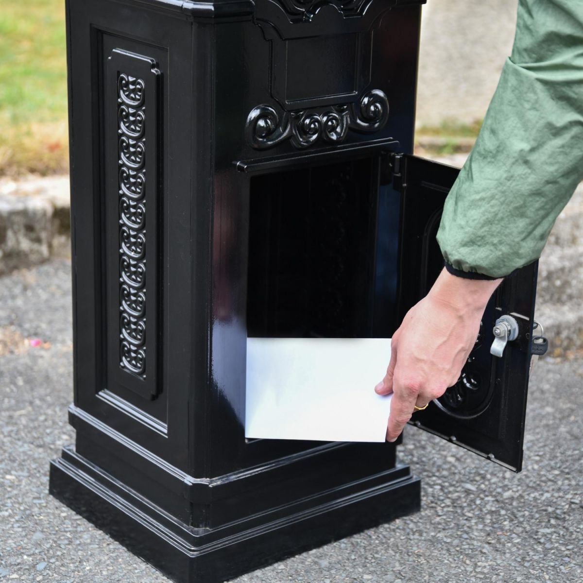 Parcel Door in Use on “Blackberry Harvest” Black Camden Deluxe Free Standing Post Box
