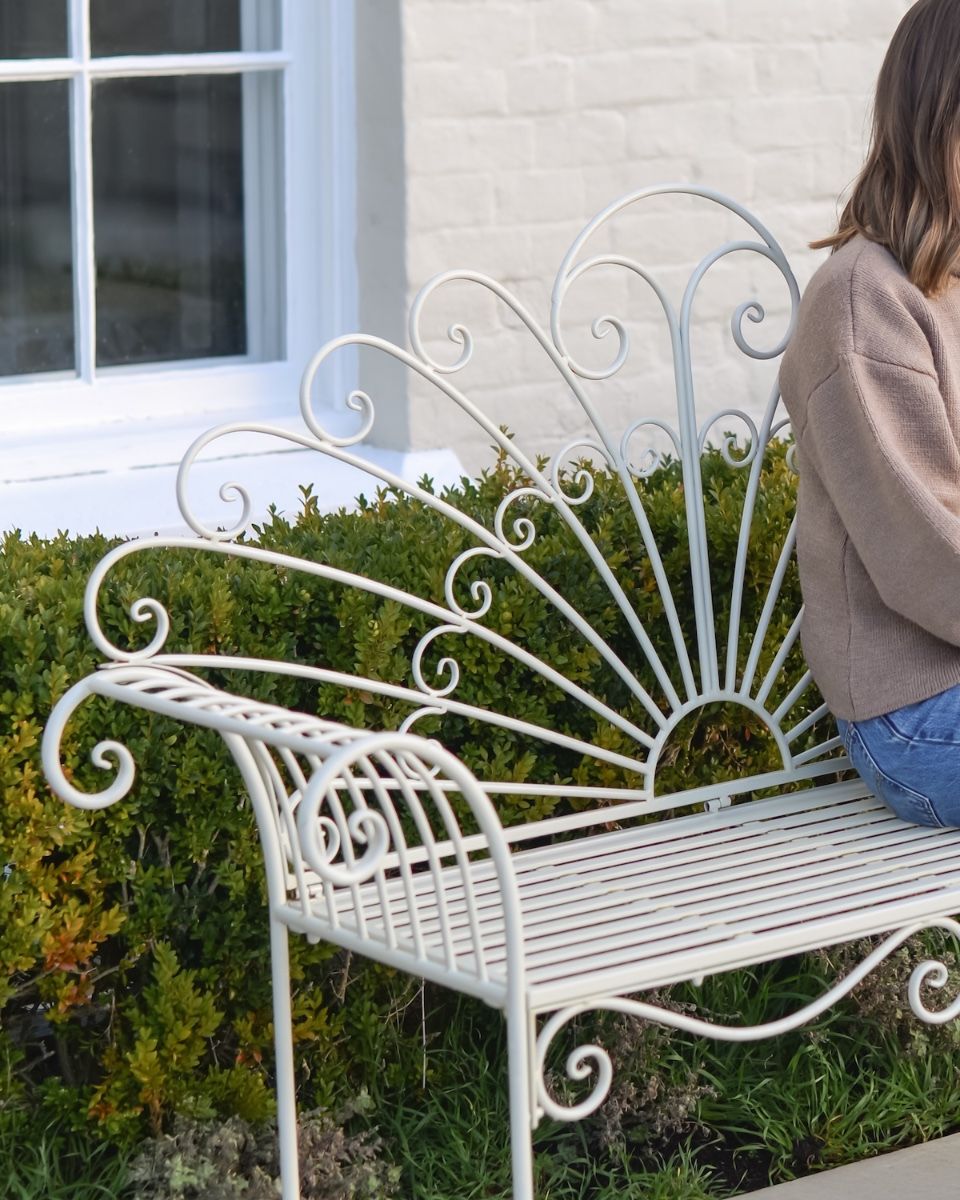 ‘Bordeaux" Wrought Iron Garden Bench - Cream lady sat on bench with close up of backrest