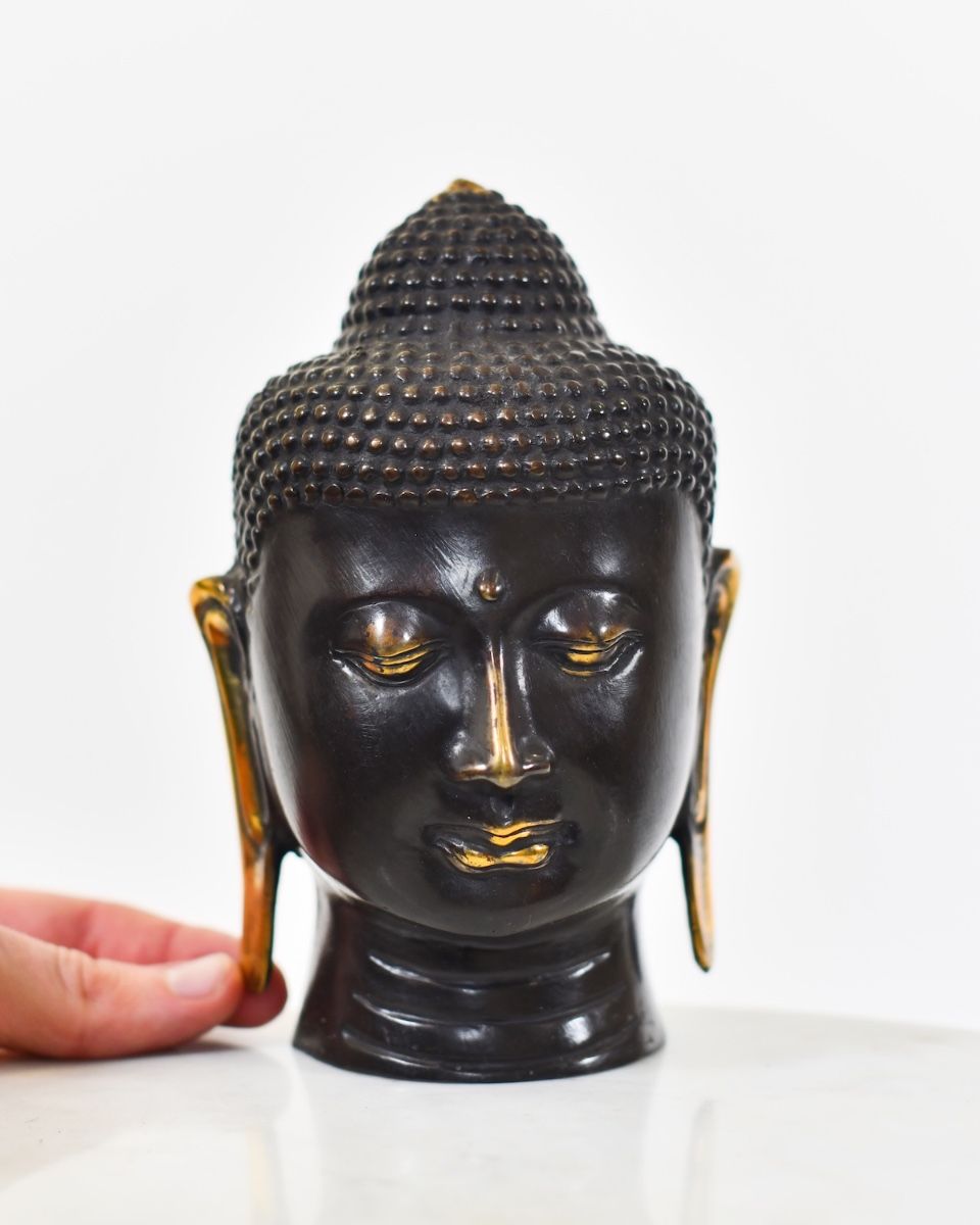 "Boundless Breath" Cast Brass Ornament with hand in shot for scale