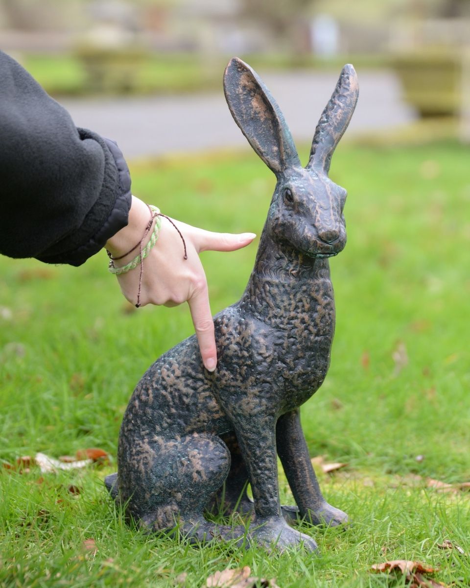 "Briar" the Hare Cast Aluminium Garden Sculpture - Verdigris to scale with hand in shot for reference