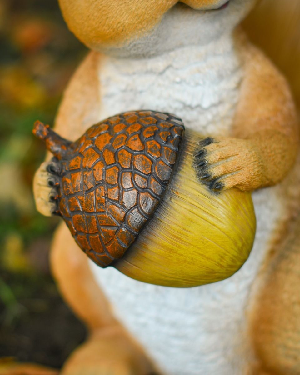 "Caper" the Handpainted Fibreglass Squirrel Garden Sculpture close up of acorn