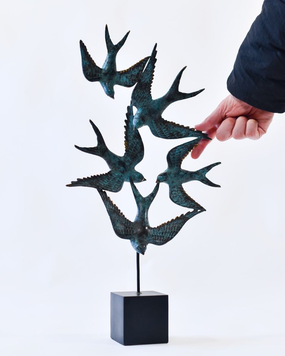 "Celestial Migration" Cast Brass Bird Sculpture with hand in shot for scale
